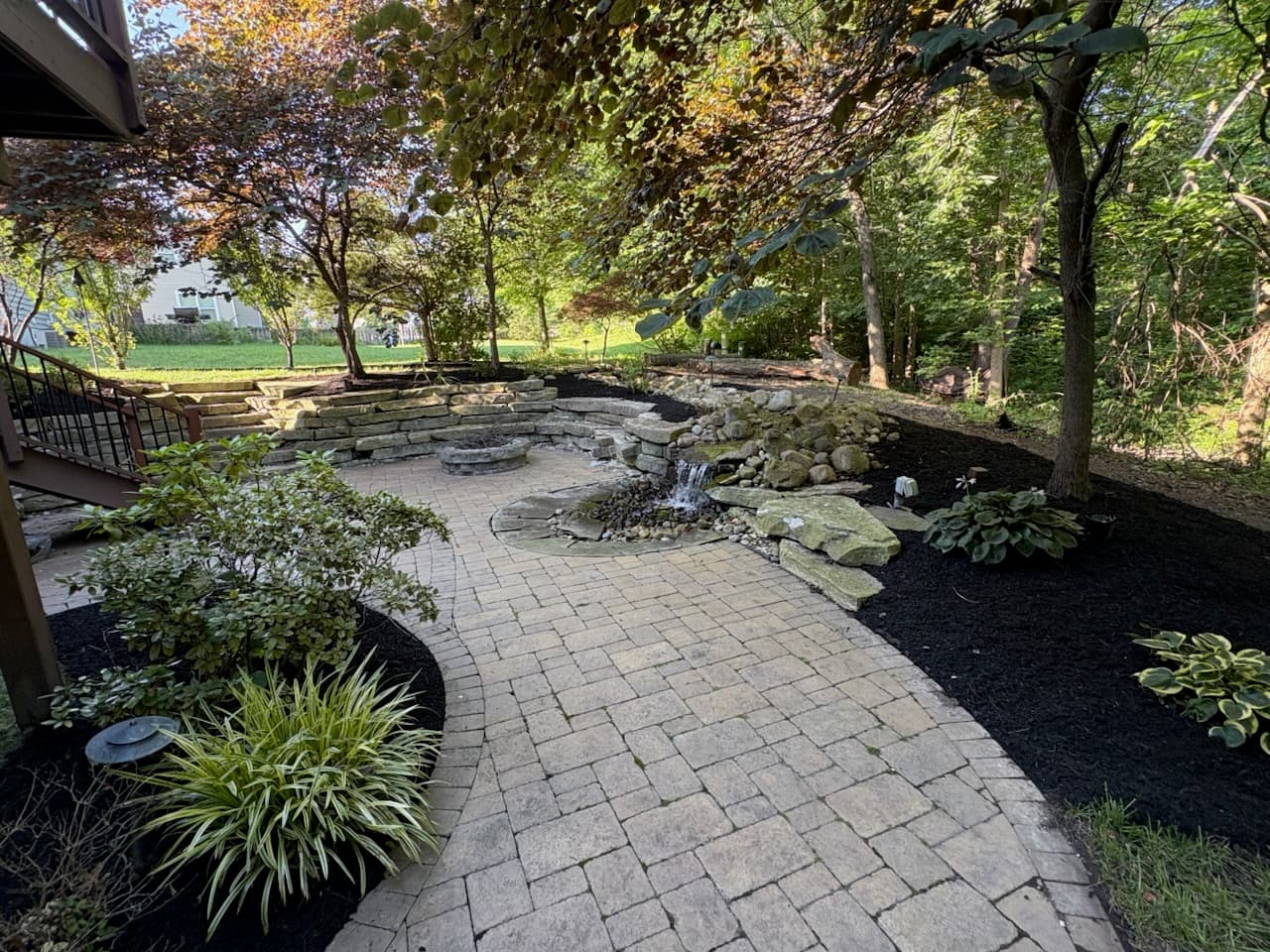 Professional landscape maintenance team working on a beautiful lawn